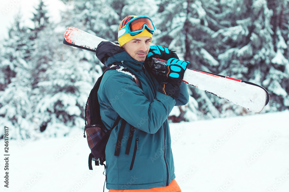 Man skier enjoying winter in mountains