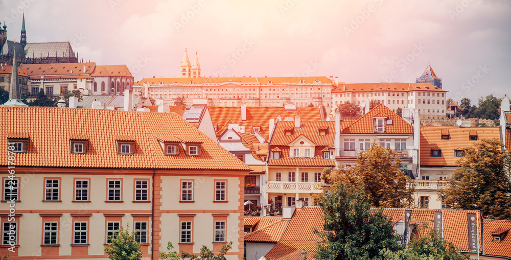 Urban landscape, European architecture of old town, houses with pitched roofs bright orange tiles,