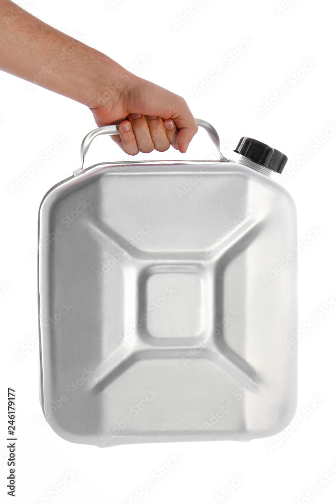 Man's hand holds a metal can for gasoline, isolated on white background Man's hand holds a metal can for gasoline, isolated on white background