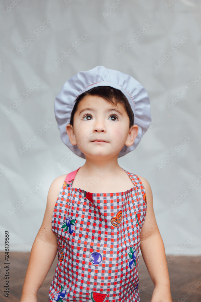 Child. Games. Little boy. Cooking. Dreams of childhood. Professions Cook Cook. Sweet little cute boy is learning how to make a cake, in the home kitchen, Family concept. Child. Games. Little boy. Cooking. Dreams of childhood. Professions Cook Cook. Sweet little cute boy is learning how to make a cake, in the home kitchen, Family concept.