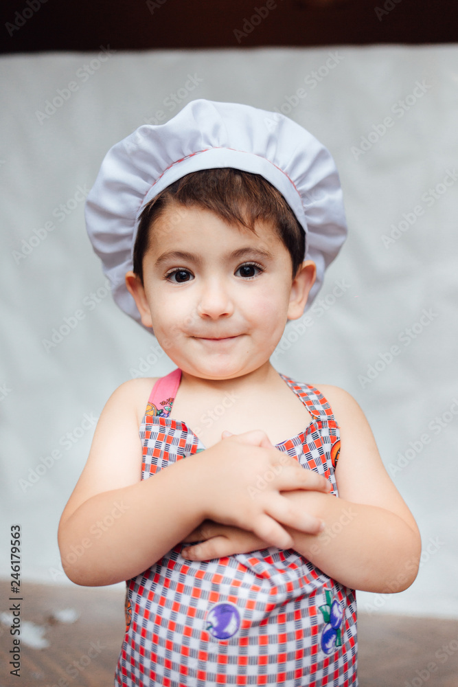 Child. Games. Little boy. Cooking. Dreams of childhood. Professions Cook Cook. Sweet little cute boy is learning how to make a cake, in the home kitchen, Family concept. Child. Games. Little boy. Cooking. Dreams of childhood. Professions Cook Cook. Sweet little cute boy is learning how to make a cake, in the home kitchen, Family concept.