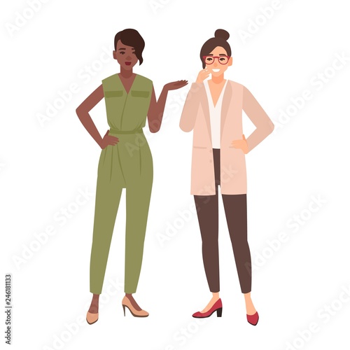 Pair of smiling women dressed in business clothes or female office workers talking to each other and laughing. Conversation between colleagues. Gossip at work. Flat cartoon vector illustration.