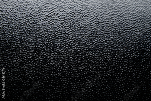 Black fake leather surface background or texture