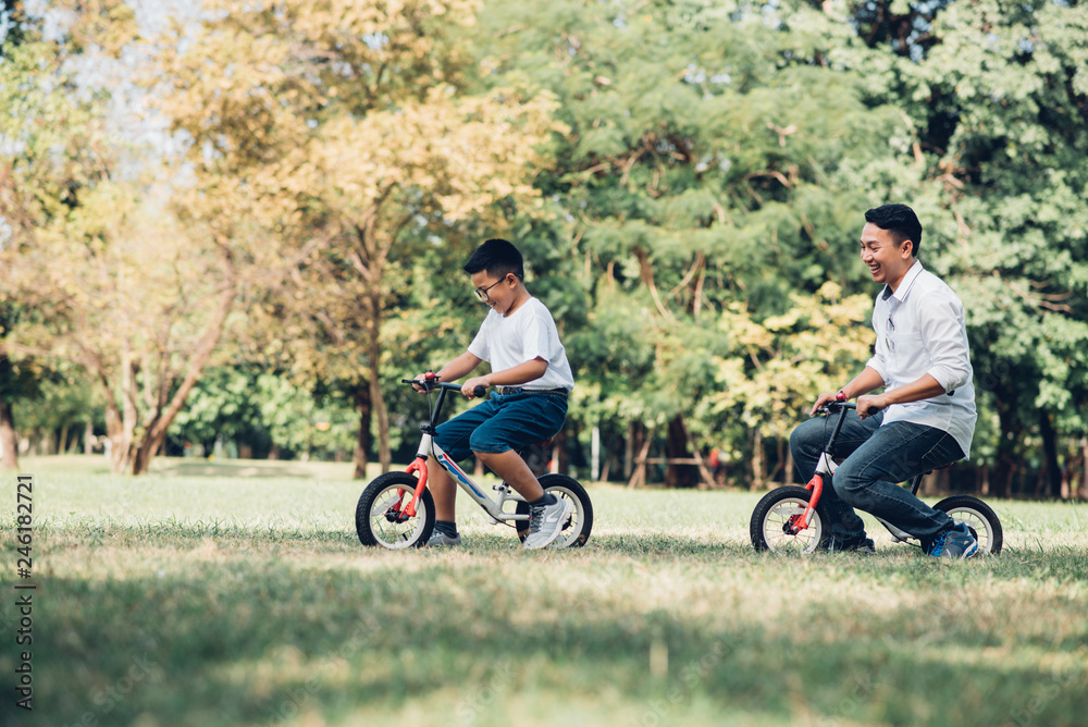 Happy children and parents playing in the park. Concept family relaxation. Happy children and parents playing in the park. Concept family relaxation.