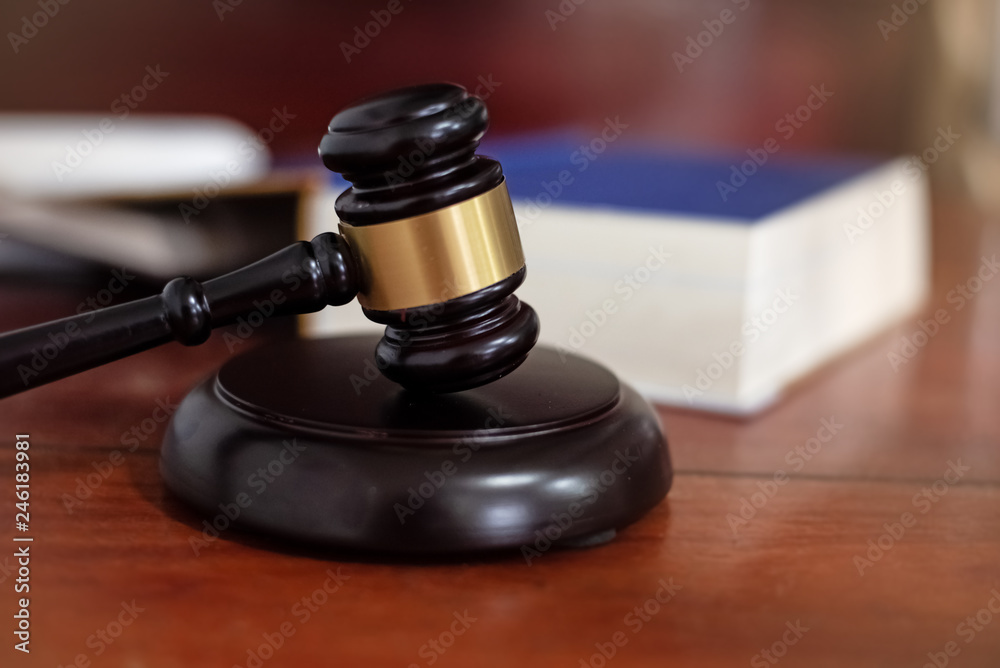 The judge gavel,Hammer of justice,Law concept,blurry light around The judge gavel,Hammer of justice,Law concept,blurry light around
