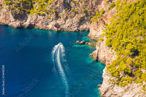 Boat going along beautiful sea coast in Greece