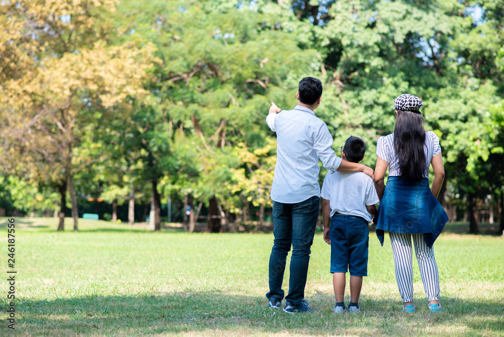 Happy children and parents playing in the park. Concept family relaxation. Happy children and parents playing in the park. Concept family relaxation.