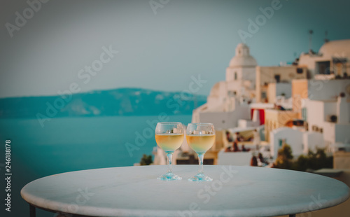 romantic vacation in Greece -two wine glasses in Santorini
