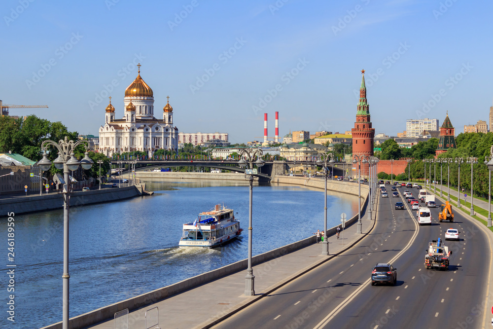 View of walls of Moscow Kremlin and Cathedral of Christ the Saviour on a background of Moskva river in sunny summer morning