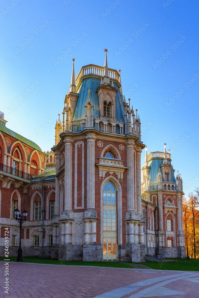 Fragment of Grand palace in Tsaritsyno park in Moscow against blue sky at sunny autumn day