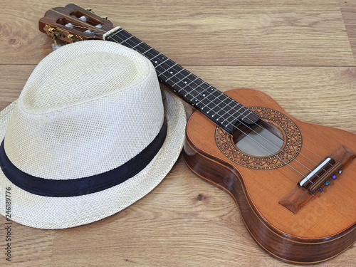 A samba player (sambista) hat and a cavaquinho, a small Brazilian string musical instrument. It is widely used to accompany samba and choro, two popular Brazilian rhythms. photo