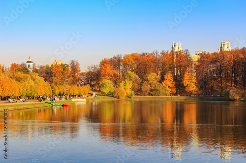 Pond in Tsaritsyno park in Moscow against blue sky at sunny autumn day
