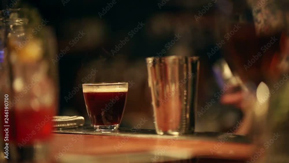 Bartender working. Mixing an espresso based cocktail Bartender working. Mixing an espresso based cocktail