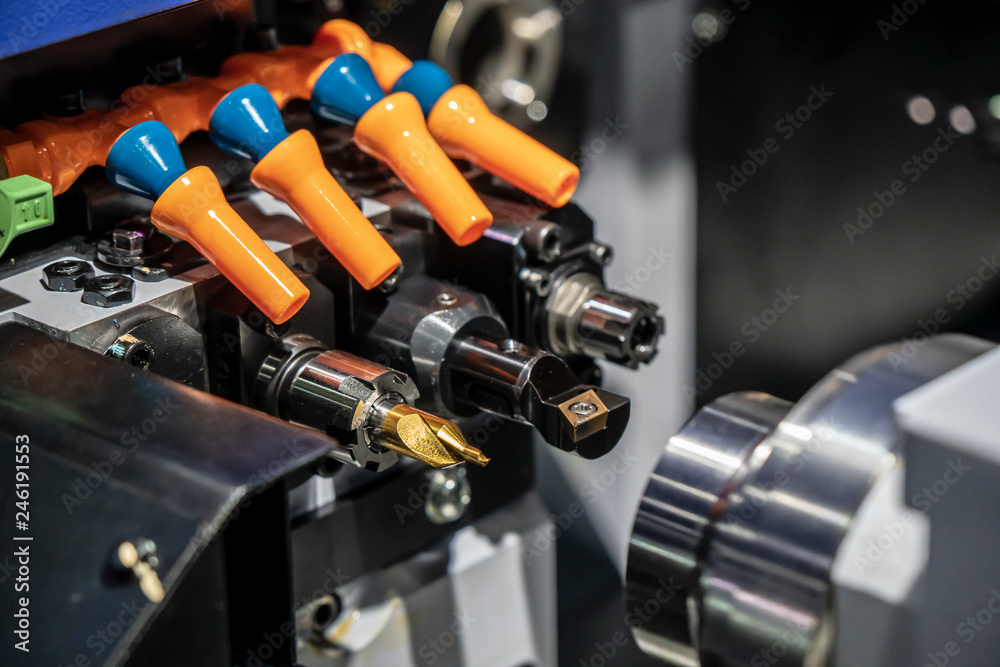 The operation of CNC lathe or turning machine. Hi-technology manufacturing process. The operation of CNC lathe or turning machine. Hi-technology manufacturing process.