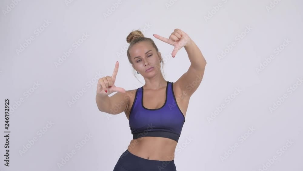 Young beautiful blonde woman focusing with fingers Young beautiful blonde woman focusing with fingers