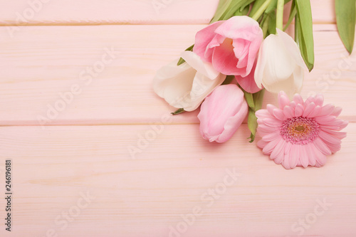 Valentine's day composition with flowers. Valentine card. Greeting card template. Space for text. Concept of Happy Valentine's day. Mother's day card. Spring flowers on pink background