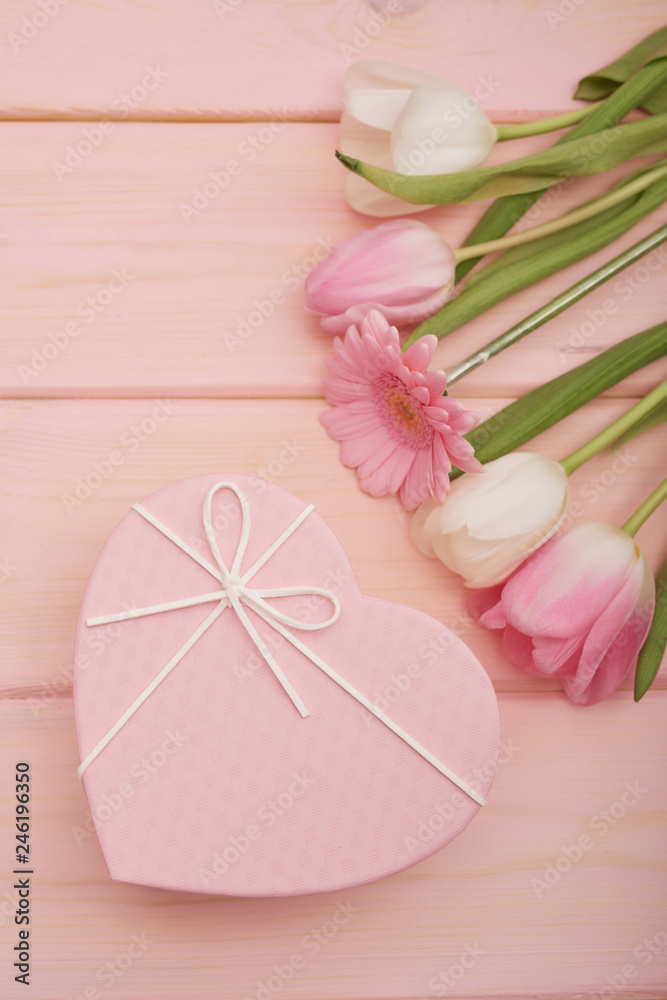 Valentine's day composition pink gift box with flowers. Valentine card. Greeting card template. Space for text. Concept of Happy Valentine's day. Mother's day card. Spring flowers on pink background Valentine's day composition pink gift box with flowers. Valentine card. Greeting card template. Space for text. Concept of Happy Valentine's day. Mother's day card. Spring flowers on pink background