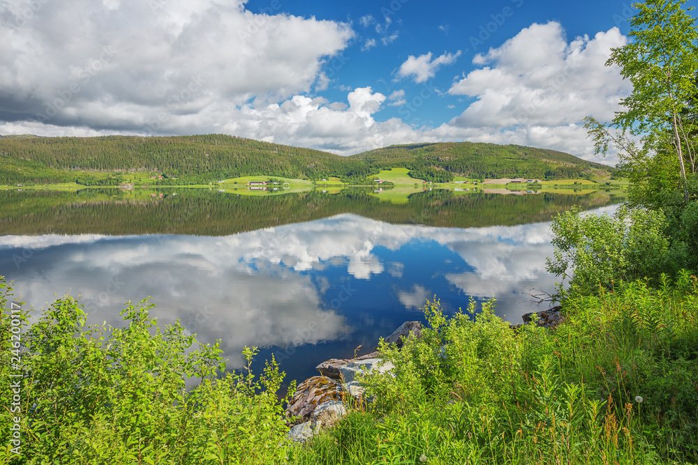 Reflections of two hills in the Eidsvatnet lake