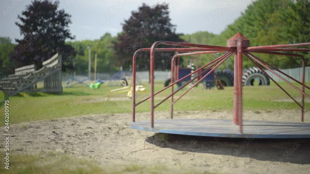 Abandoned Empty Old Merry Go Round Spinning at Children's Playground Flat Unsaturated 4K ProRes