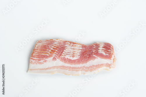 Slices of bacon on a white background. View from above.