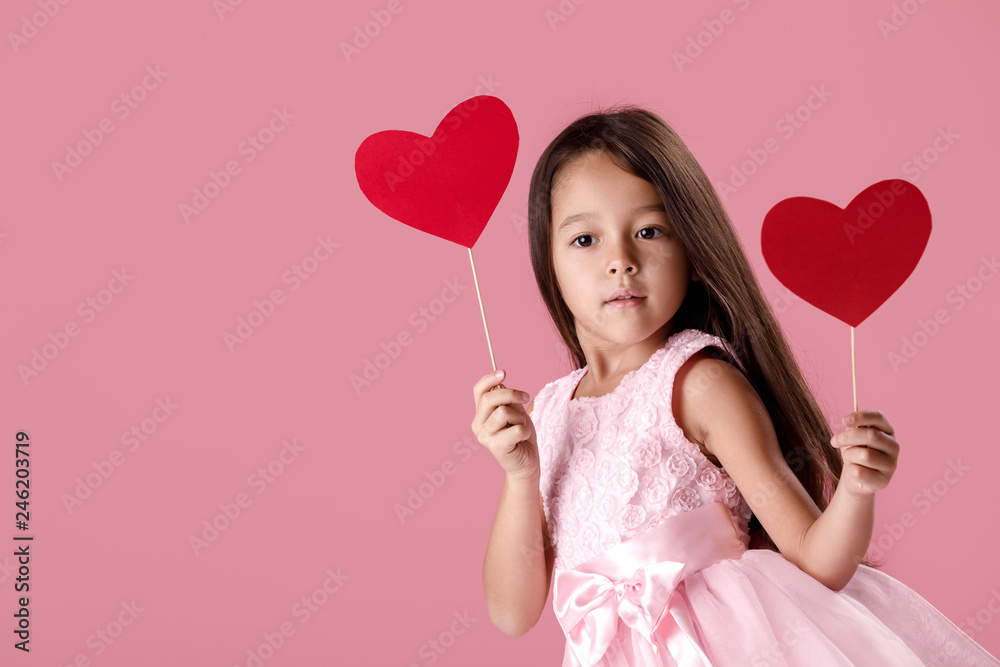 cute little girl in a pink dress holding a paper heart cute little girl in a pink dress holding a paper heart