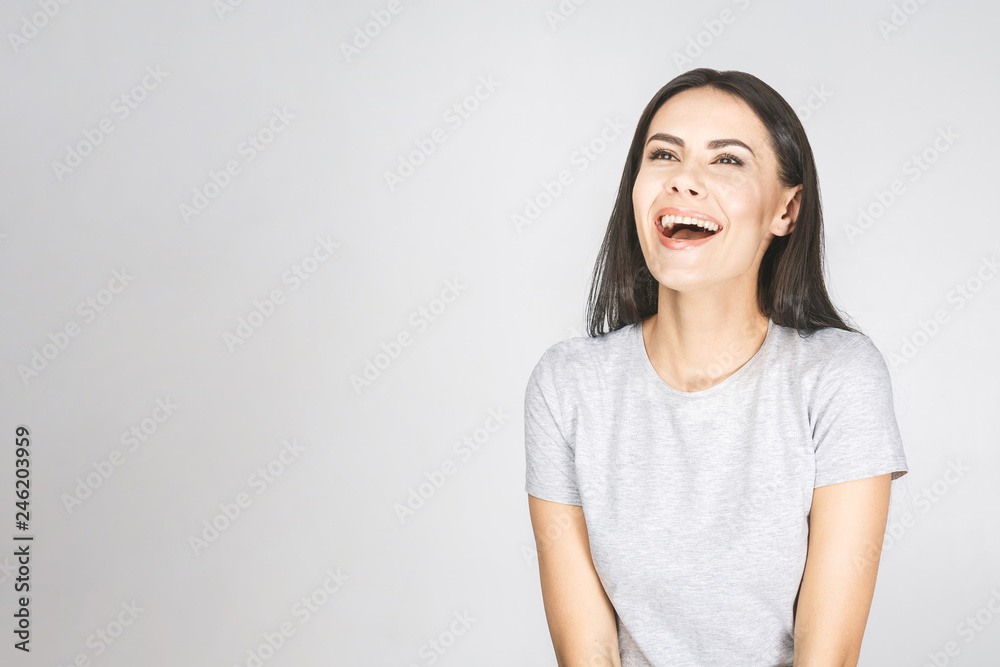 Wow! It's amazing! Portrait of a smiling pretty woman looking up isolated on a white background. Wow! It's amazing! Portrait of a smiling pretty woman looking up isolated on a white background.