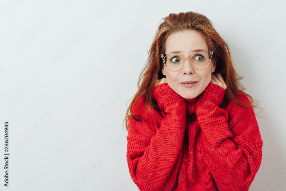 Young woman with a fearful look of trepidation Young woman with a fearful look of trepidation