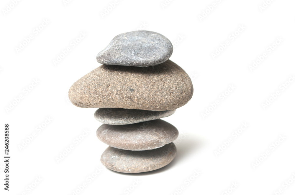 closeup of stone balance on white background closeup of stone balance on white background