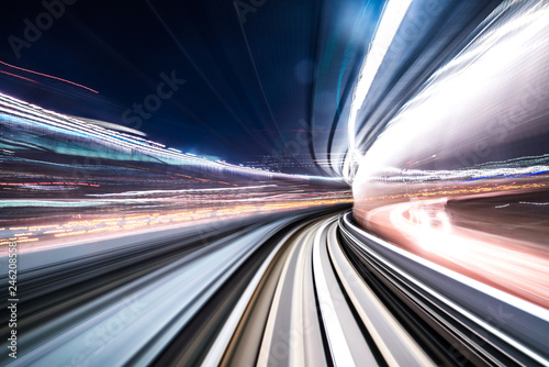 Motion blur of train moving inside tunnel with daylight in tokyo, Japan.