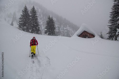 a man enjoys his ski tour through the winter wonderland