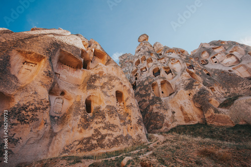 Cappadocia, a semi-arid region in central Turkey, is known for its distinctive “fairy chimneys,” tall, cone-shaped rock formations clustered in Monks Valley, Göreme and elsewhere.  photo