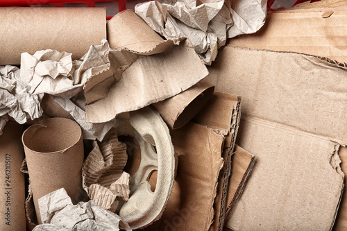 Pile of paper and cardboard garbage as background, top view. Recycling problem
