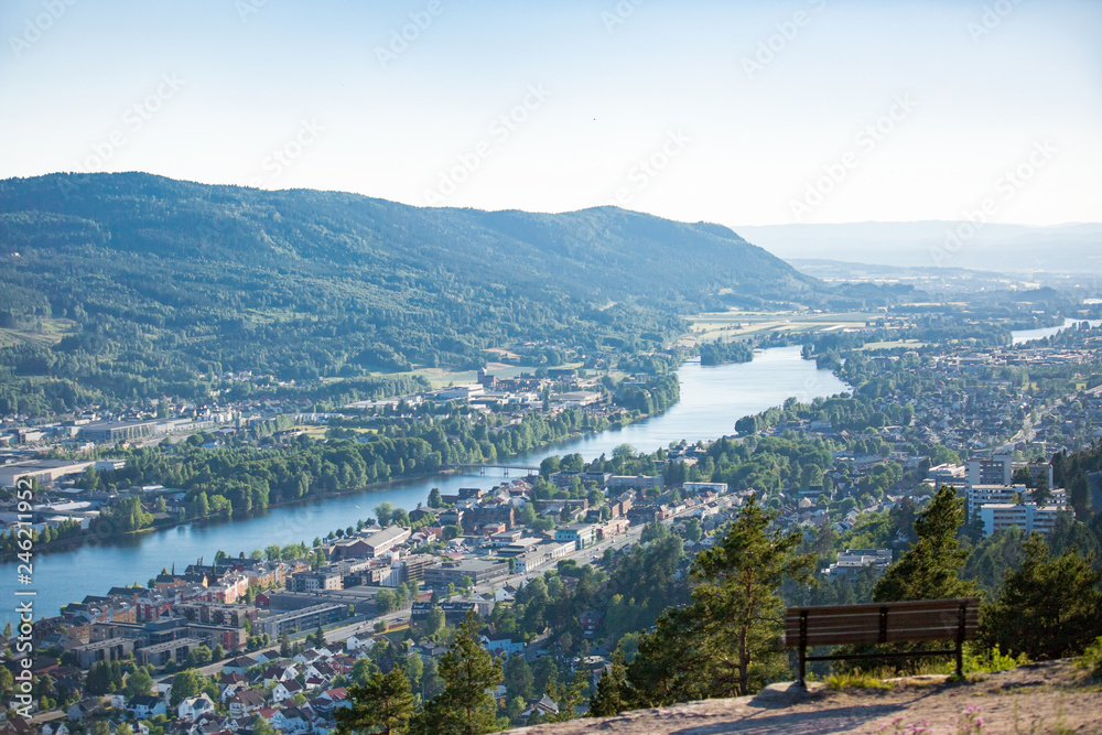 Panoramic top view of Drammen city, mountains in fog and valley with river, sunny weather. Norway
