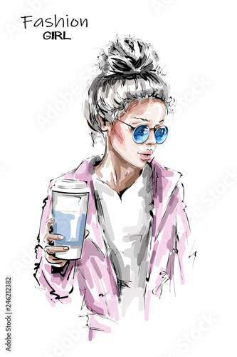 Hand drawn beautiful young woman holding plastic coffee cup. Stylish blonde hair girl. Fashion woman look. Sketch.