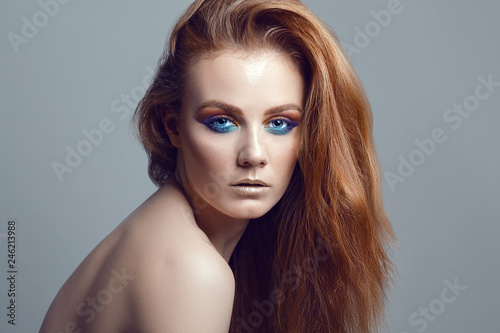 Portrait of beautiful woman with long ginger hair.