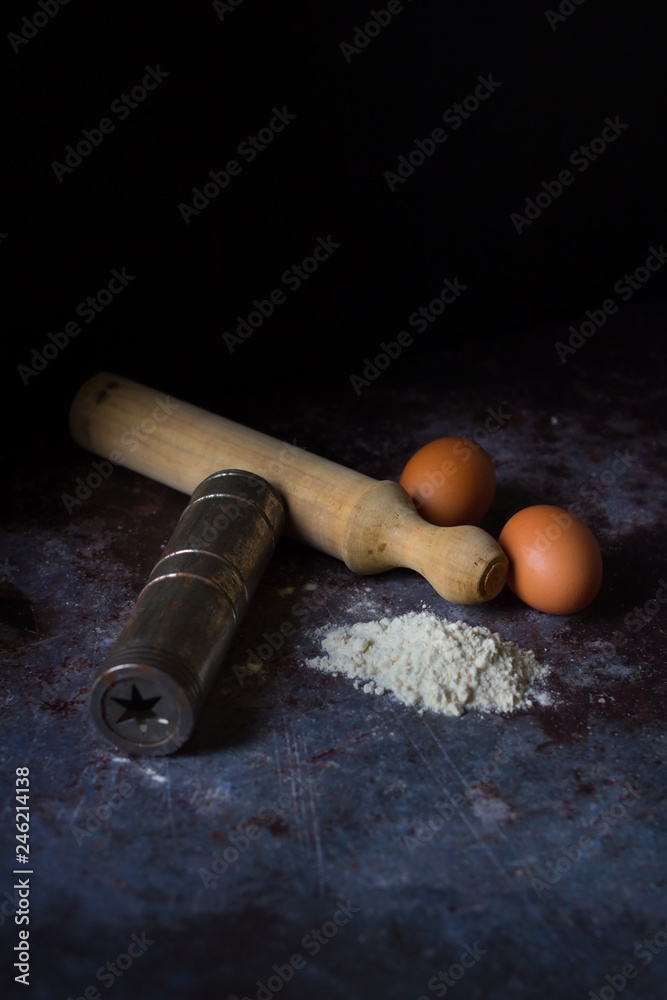 cooks keep rolling pin, wooden dining table, flour, dough