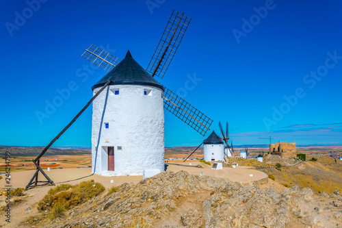 Castle at Consuegra surrounded with white windmills, Spain
