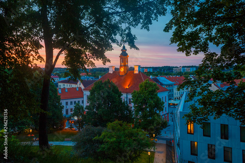 Summer sunset and the beautiful sky above the Tartu Town Hall and historical part of the city, view from the Dome hill. Tartu, Estonia