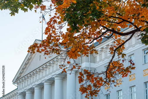 Pediment and colonnade of the main building of the University of Tartu, Estonia, during autumn, view from the intersection of streets Ulikooli and Gildi photo