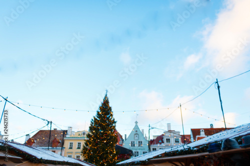 Christmas tree, facades of historical buildings in the Town Hall Square and the roofs of the tents of the Christmas Market, Tallinn, Estonia