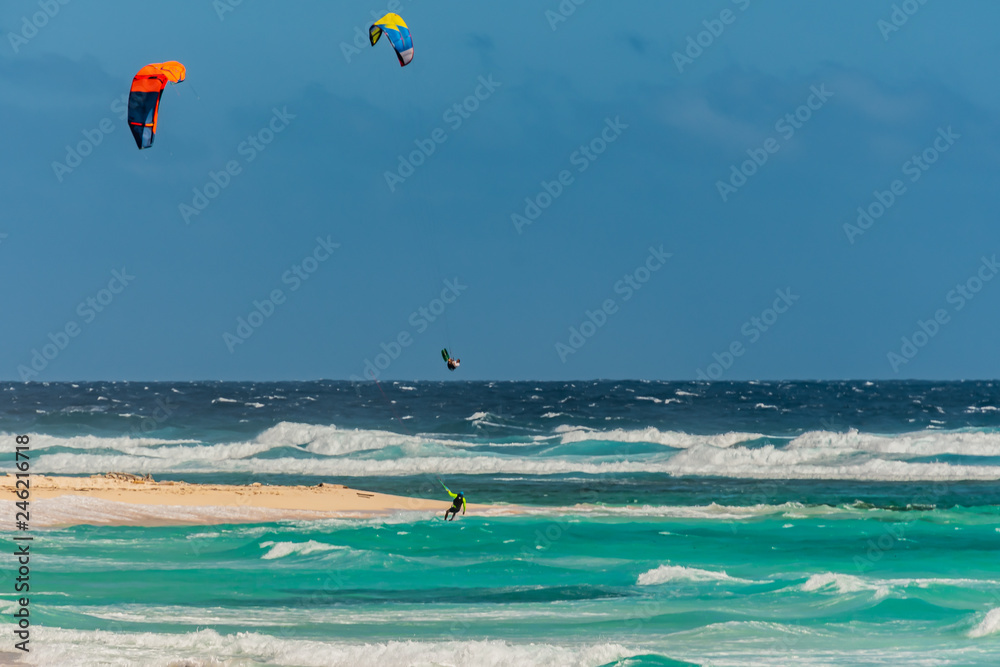 Kiteboarding off the beaches of Aruba in the high surf and on a windy day Kiteboarding off the beaches of Aruba in the high surf and on a windy day