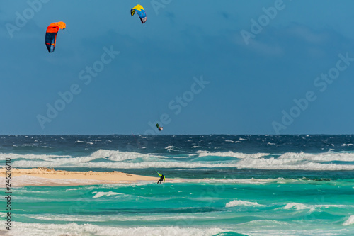 Kiteboarding off the beaches of Aruba in the high surf and on a windy day