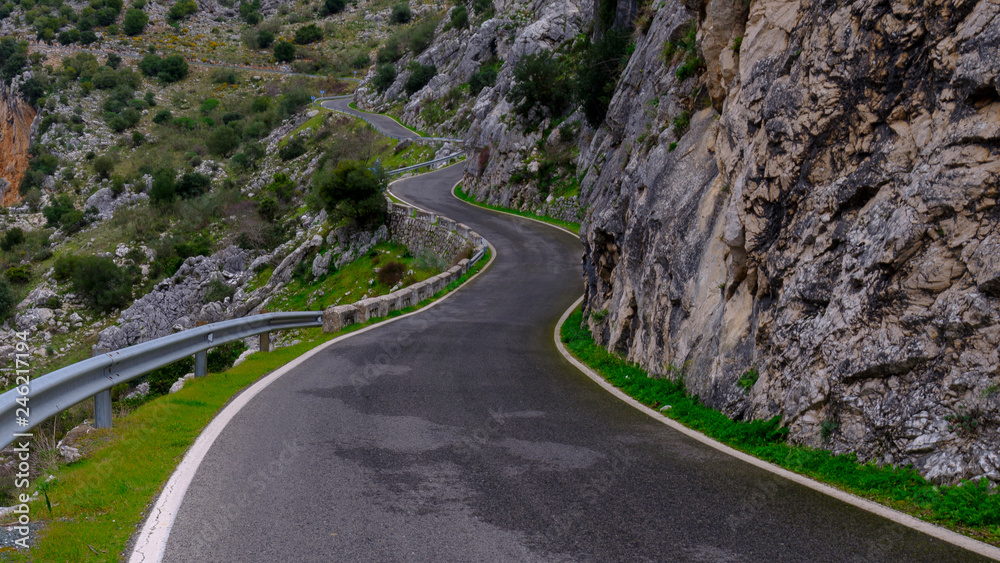 Twisting mountain road in the Sierra Grazalema near the Cueva del Hundidero and Montejaque, Spain