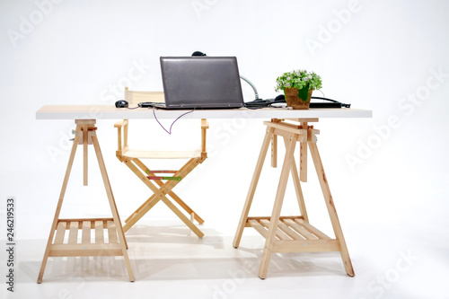 Studio wood table with laptop and microphone, small plant pot design for traing and live on social media. Image isolated white background