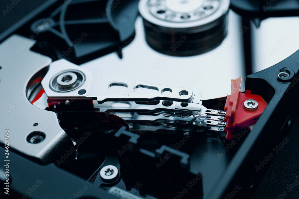 Disassembled magnetic device hard disk, hard drive, data storage, HDD, Read  and write head with the shiny metal platter. IT Technology, Computer  peripheral equipment repair, inspection concepts. Photos | Adobe Stock