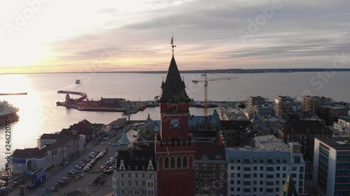 Aerial view of central Helsingborg, Sweden at sunset. Clock tower at r√•dhuset going around from left to right. photo