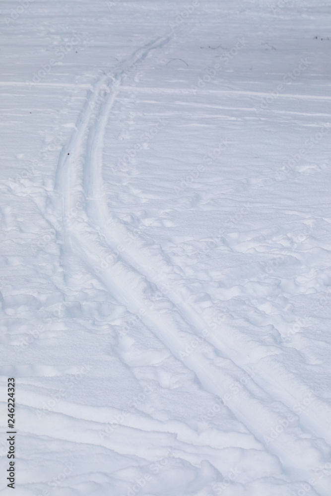 Traces from skis on snow