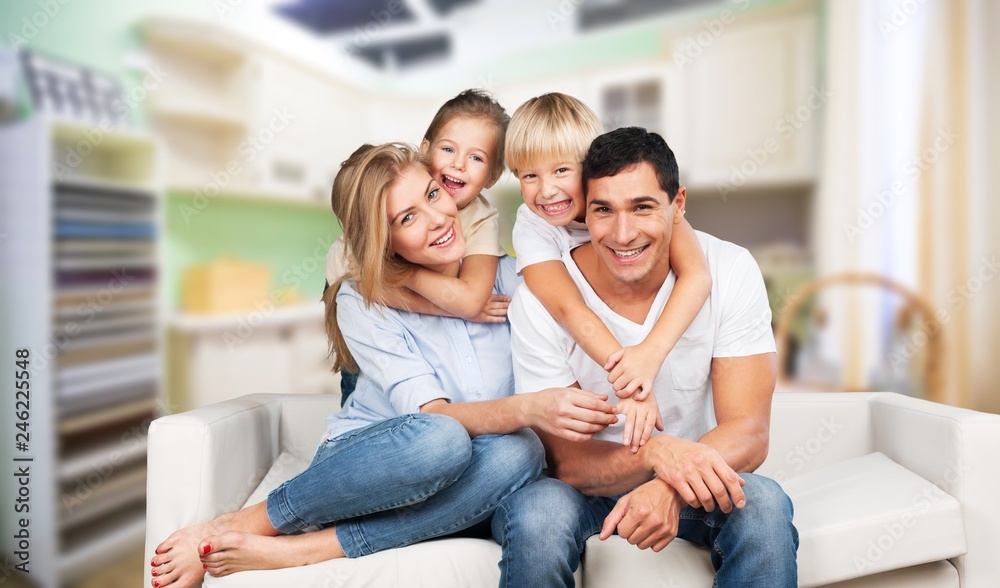 Young family at home smiling at camera Young family at home smiling at camera