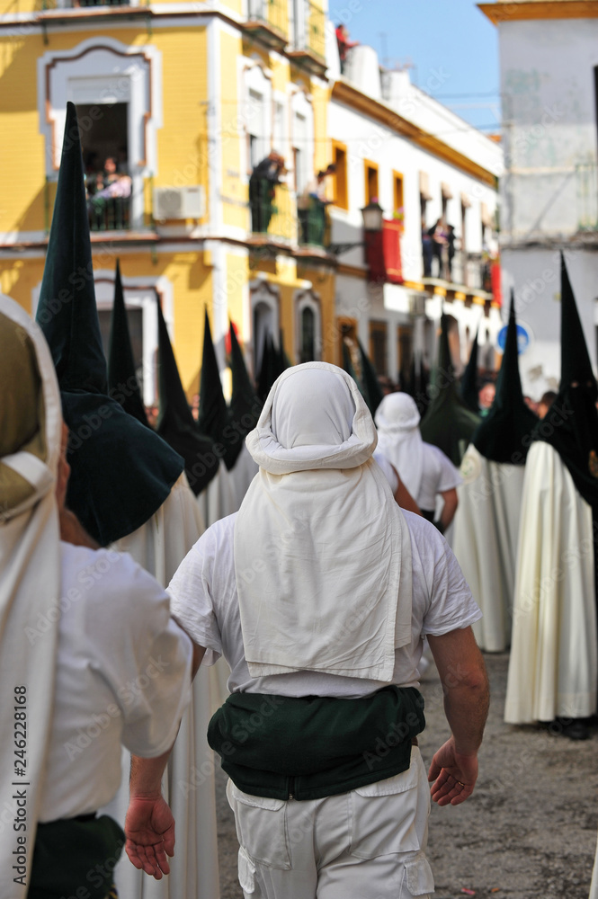 Procession of Holy Week (Semana Santa) in Seville. Holy Friday morning. Bearers (costaleros) of the brotherhood of the Our Lady of Hope (Esperanza) in Triana. Procession of Holy Week (Semana Santa) in Seville. Holy Friday morning. Bearers (costaleros) of the brotherhood of the Our Lady of Hope (Esperanza) in Triana.