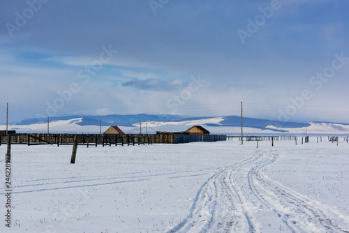 Winter village view. Snow covered mountains. Moubtains, buildings photo